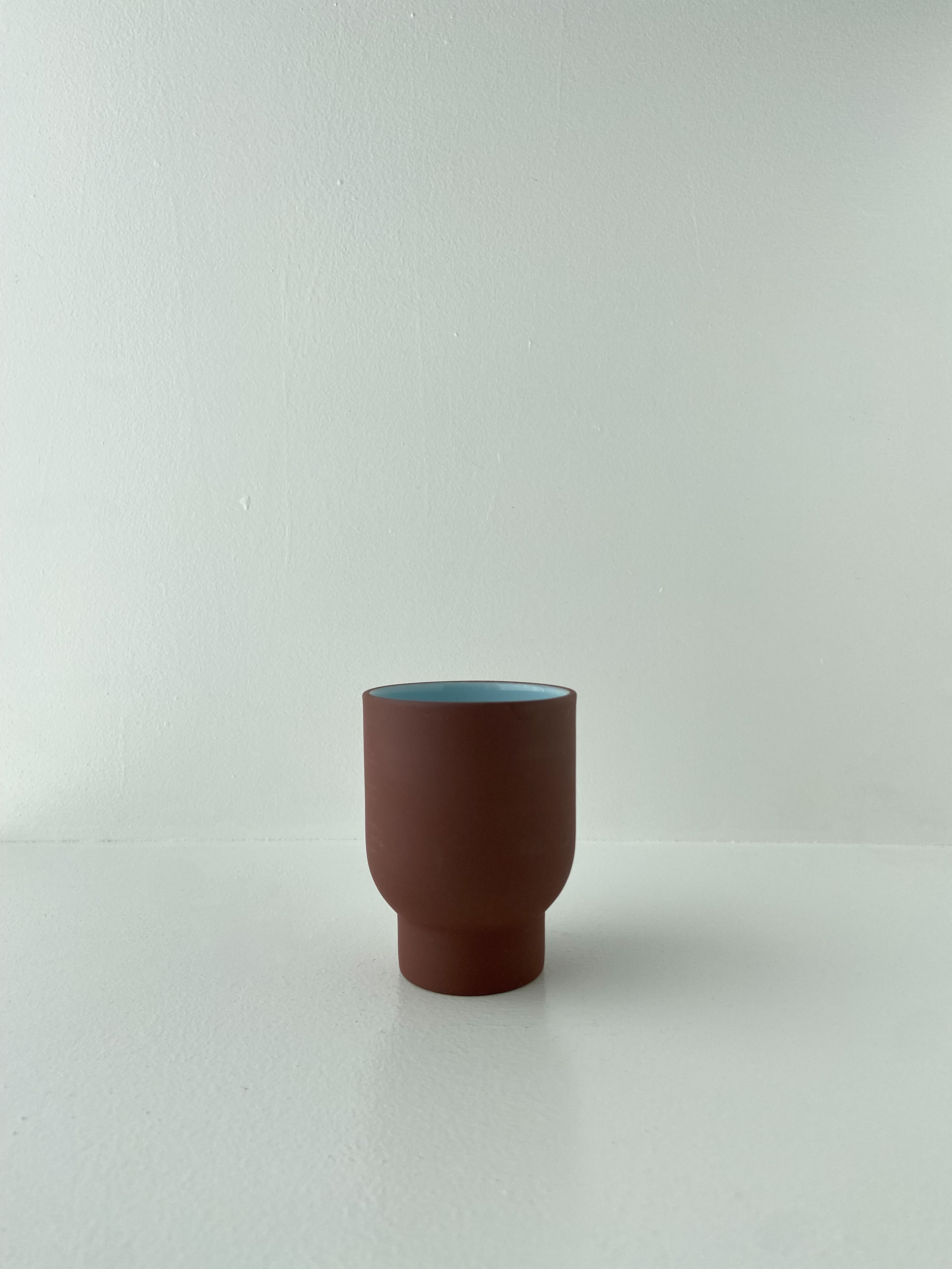 StudioAbout-CLAYWARE_CUP_TALL_TERRACOTTA_BLUE.jpg